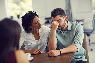 Buy stock photo Cropped shot of a wife consoling her husband during a counselling session with a therapist