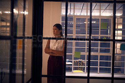 Buy stock photo Shot of a young businesswoman looking anxious in an office