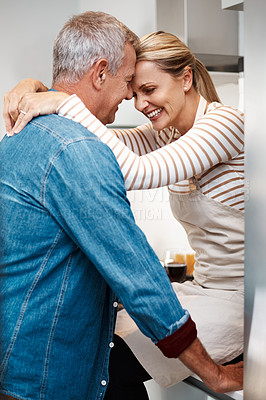 Buy stock photo Cropped shot of a loving couple in the kitchen