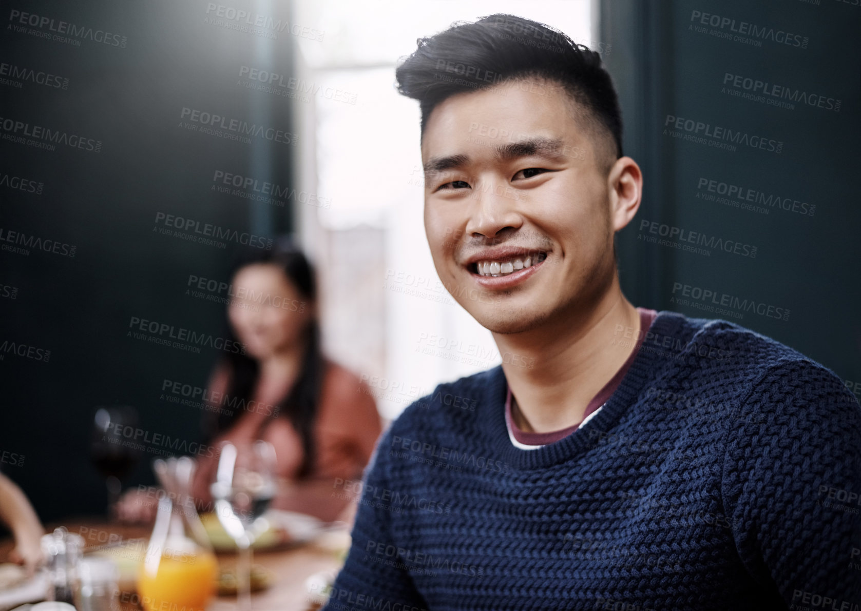 Buy stock photo Portrait of a handsome young man having a meal with his wife at home
