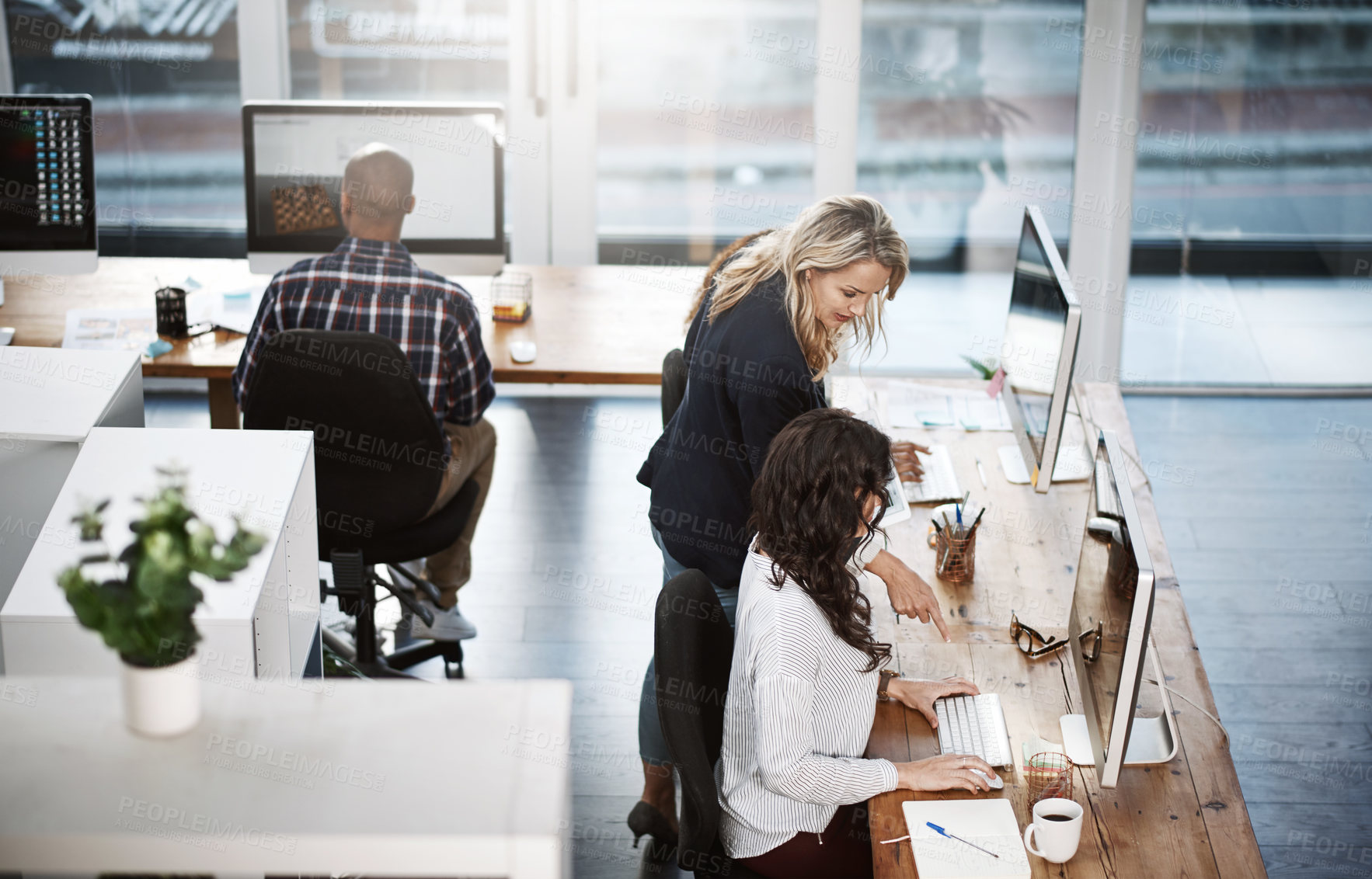 Buy stock photo Shot of a group of businesspeople working in an office