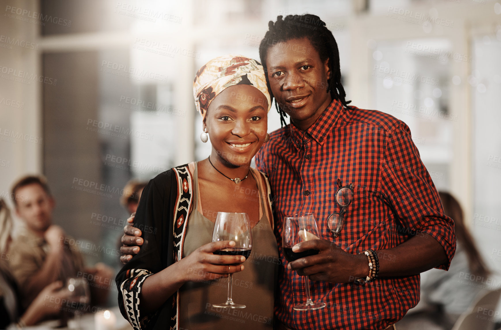 Buy stock photo Cropped portrait of an affectionate young couple enjoying a glass of wine