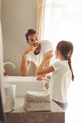 Buy stock photo Brushing teeth, father and child learn in a bathroom at home in morning with dental cleaning. Oral hygiene, kids and dad together in a house with bonding and parent love for children with toothbrush