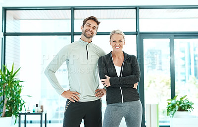 Buy stock photo Cropped shot of two people standing together in a fitness center