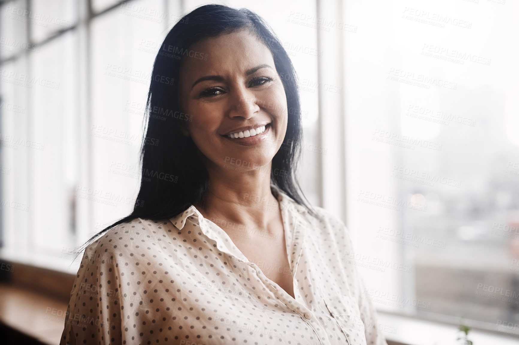 Buy stock photo Portrait of a mature businesswoman standing in an office