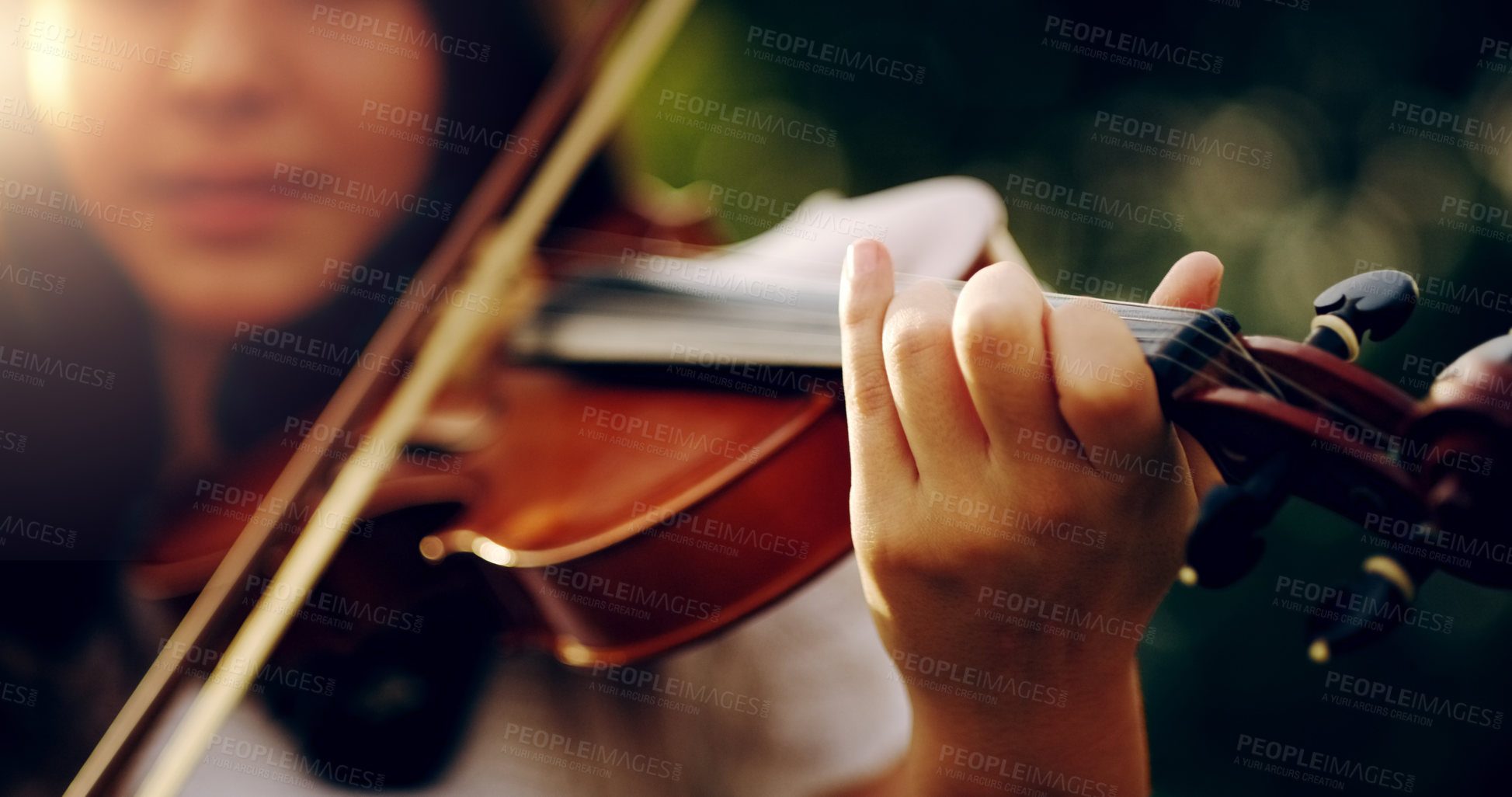 Buy stock photo Cropped shot of an unrecognizable teenage girl playing a violin outside