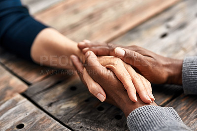 Buy stock photo High angle shot of an unrecognizable senior couple holding hands in comfort outside