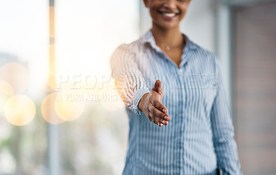 Buy stock photo Closeup shot of an unrecognizable businesswoman extending a handshake in an office