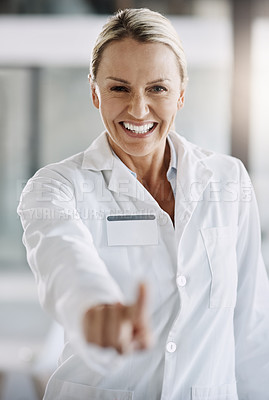 Buy stock photo Cropped portrait of an attractive mature female scientist writing down formulas on a glass wipe board while doing research in her lab