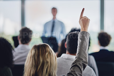 Buy stock photo Rearview shot of an unrecognizable young businesswoman raising her hand during a seminar in the conference room