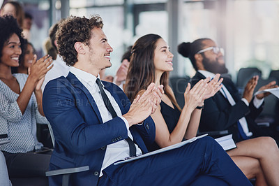 Buy stock photo Low angle shot of a group of businesspeople applauding during a seminar in the conference room