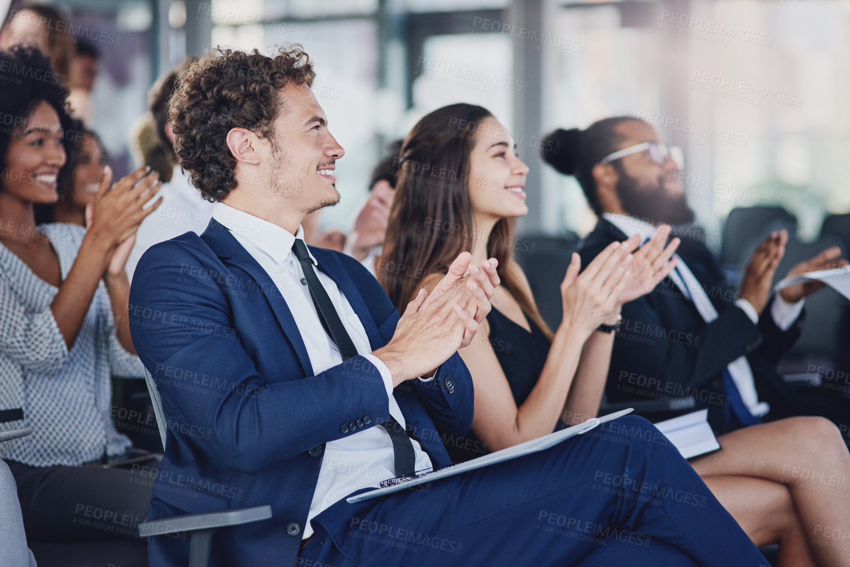 Buy stock photo Low angle shot of a group of businesspeople applauding during a seminar in the conference room