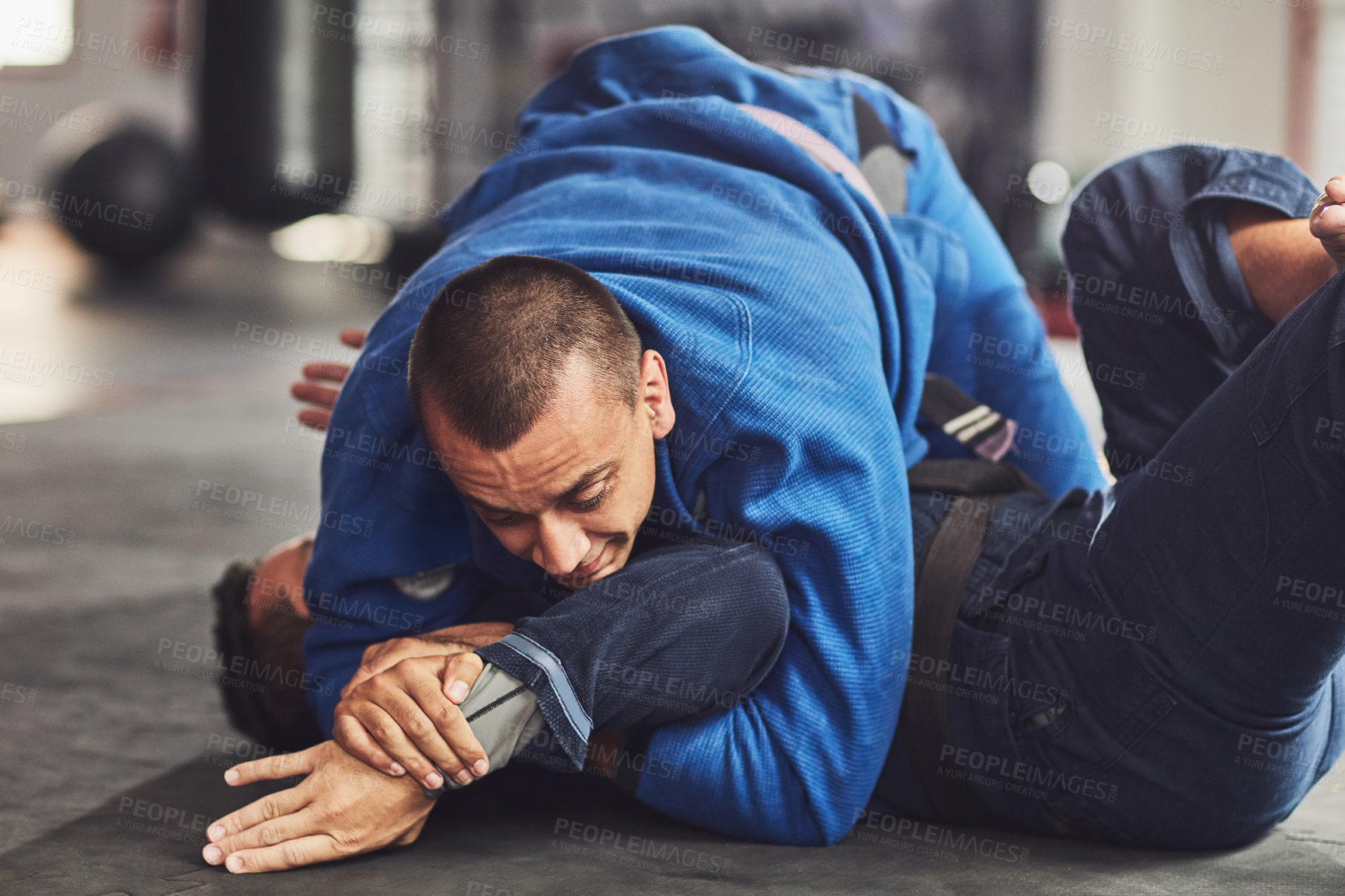 Buy stock photo Cropped shot of two professional fighters sparring in the gym