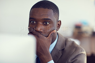 Buy stock photo Cropped shot of a young handsome businessman working in the office