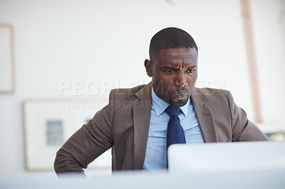 Buy stock photo Cropped shot of a young businessman working in the office