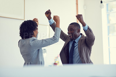 Buy stock photo Cropped shot of a young businessman and  businesswoman arms raised in celebration in the office
