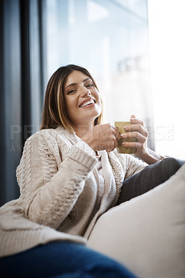 Buy stock photo Woman, home and happy with coffee to relax on day off and leisure. Female person, sofa and smile in living room with cup of tea for lunch on break, chill and self care in portrait on couch
