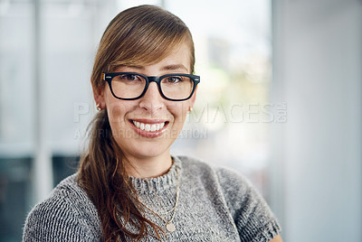 Buy stock photo Portrait of a cheerful young businesswoman standing inside the office with her arms folded at work during the day