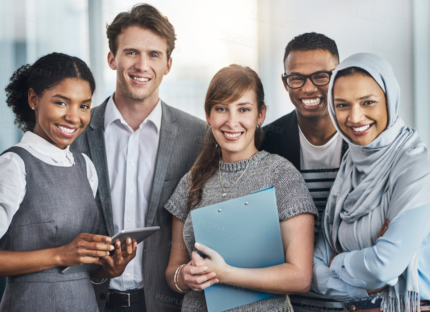 Buy stock photo Portrait of confident young business people standing inside of the office at work during the day