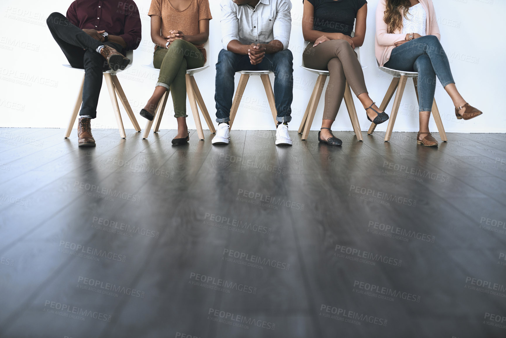 Buy stock photo Waiting room, business people and legs of candidates for interview, work opportunity and hiring. Row, job seeker and patience with floor space for creative agency, recruitment and employment process