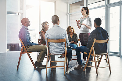 Buy stock photo Shot of a group of diverse creative employees having a meeting inside