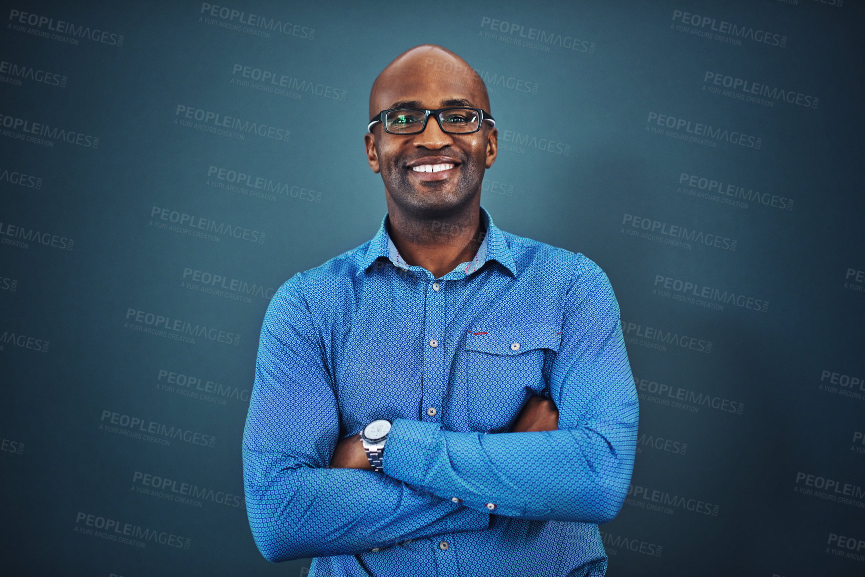 Buy stock photo Business, black man and portrait with arms crossed in a studio feeling proud from auditor work. Blue background, smile and African employee with success and leadership vision with glasses and idea