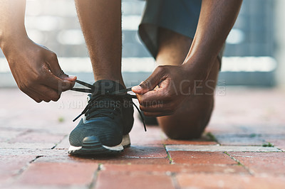 Buy stock photo Hands, outdoor and tie shoes for fitness, exercise or start workout for sports in summer. Sneakers, person and runner tying shoelace to prepare for training, health and wellness on ground in city.