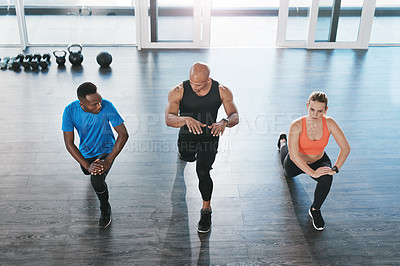 Buy stock photo Shot of people working out in the gym