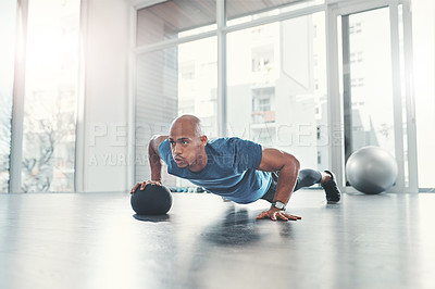 Buy stock photo Workout, man and push up in gym for fitness, health and wellness, athlete and training. Exercise, strong and bodybuilder in sport club for body endurance, performance and medicine ball for muscle