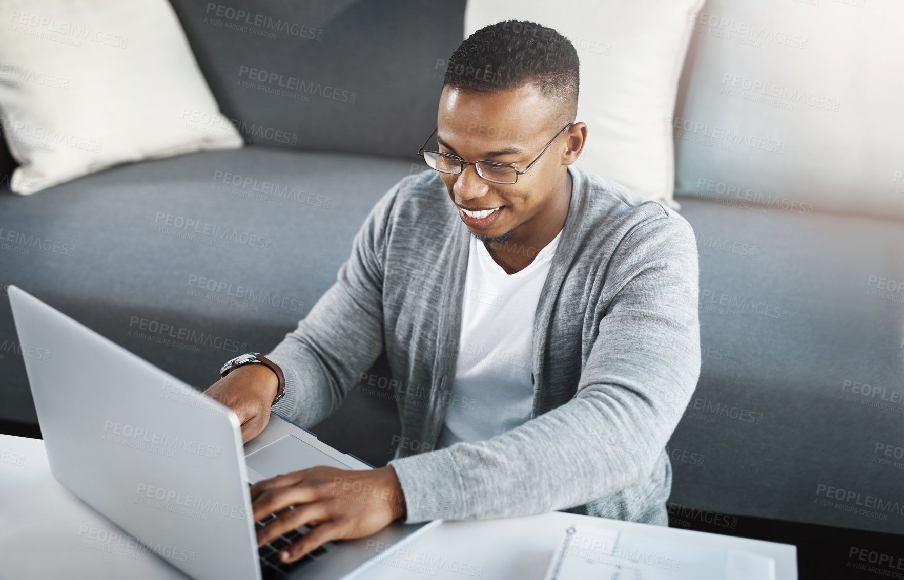 Buy stock photo Typing, man and remote work with laptop in home office on sofa with online research for writing project. Email, communication and creative writer post article to website with fast internet connection