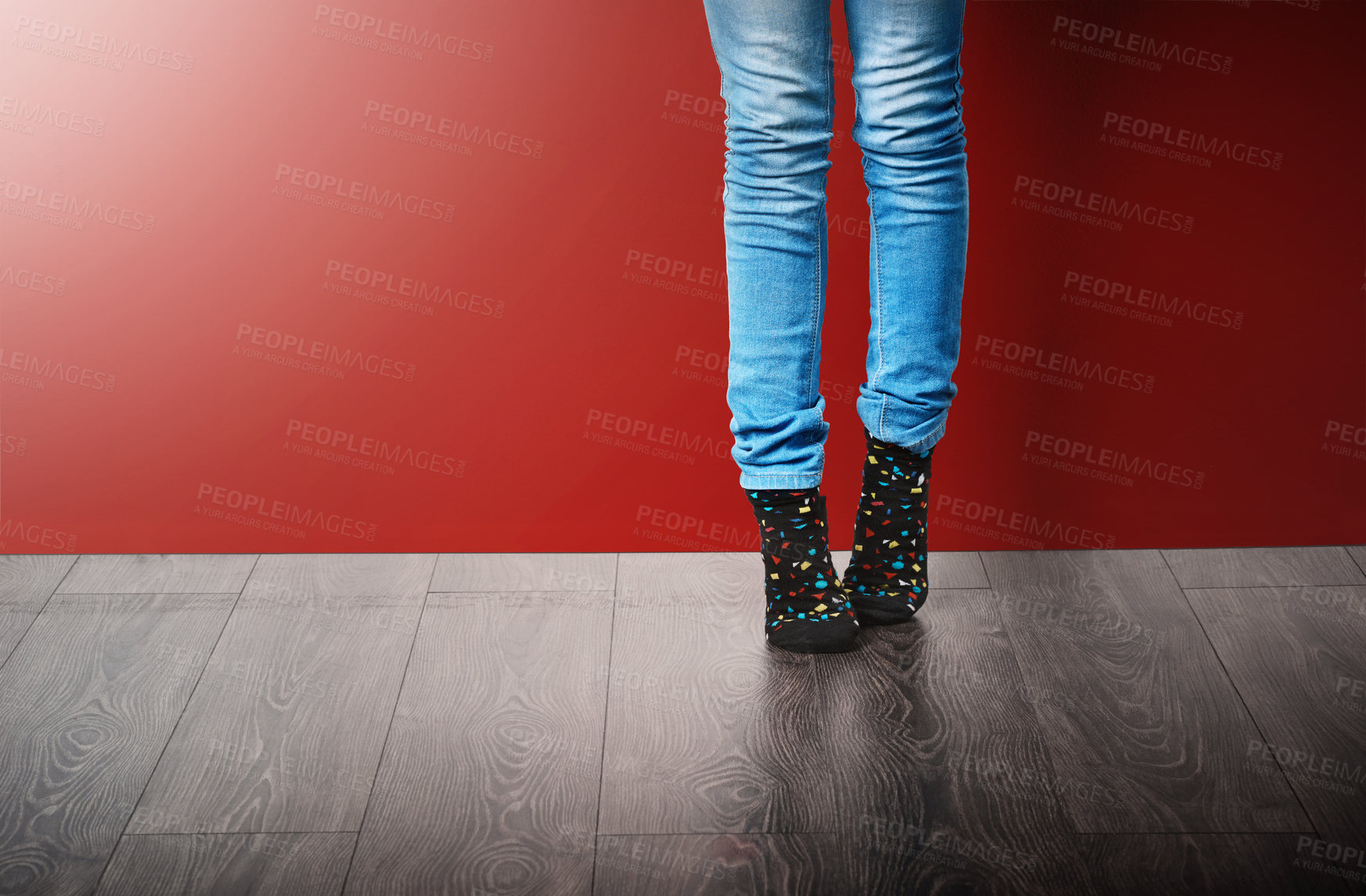 Buy stock photo Fashion, jeans and legs of woman in studio with stylish clothes standing on red background. Trendy, edgy and fashionista in modern outfit, cool style or denim for crazy socks day on floor or ground