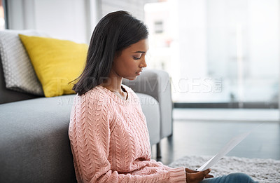 Buy stock photo Home, student or Indian woman on floor with document studying for exam or distance learning. Girl, university, college learner with paperwork for project, application or education with task deadline