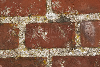 Buy stock photo Closeup of red brick wall on the rustic exterior surface of a home, house, or city building. Texture, detail of rough architecture construction design of face brick on an old decaying structure