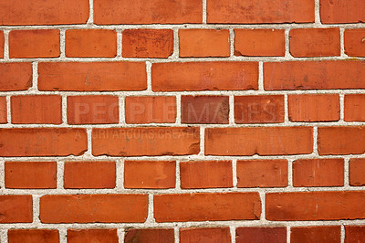 Buy stock photo Closeup of a strong red brick wall and copy space on exterior of a home, house or city building. Texture and detail background of rough architecture construction design of facebrick on old structure