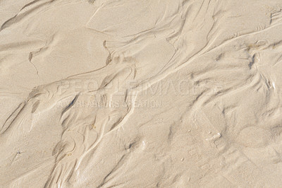 Buy stock photo Above view of beach sand with wind swept patterns from gust winds with copy space. Closeup of detail and texture background with copyspace of erosion from climate change and global warming on land