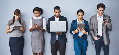 Buy stock photo Cropped shot of a group of young businesspeople waiting in line for their interviews