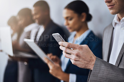 Buy stock photo Cropped shot of a group of young businesspeople waiting in line for their interviews