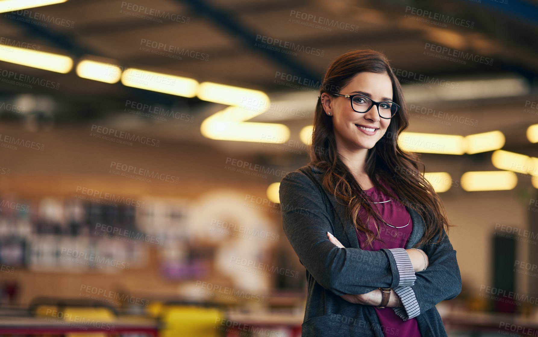 Buy stock photo Portrait of a confident young businesswoman working in a modern office