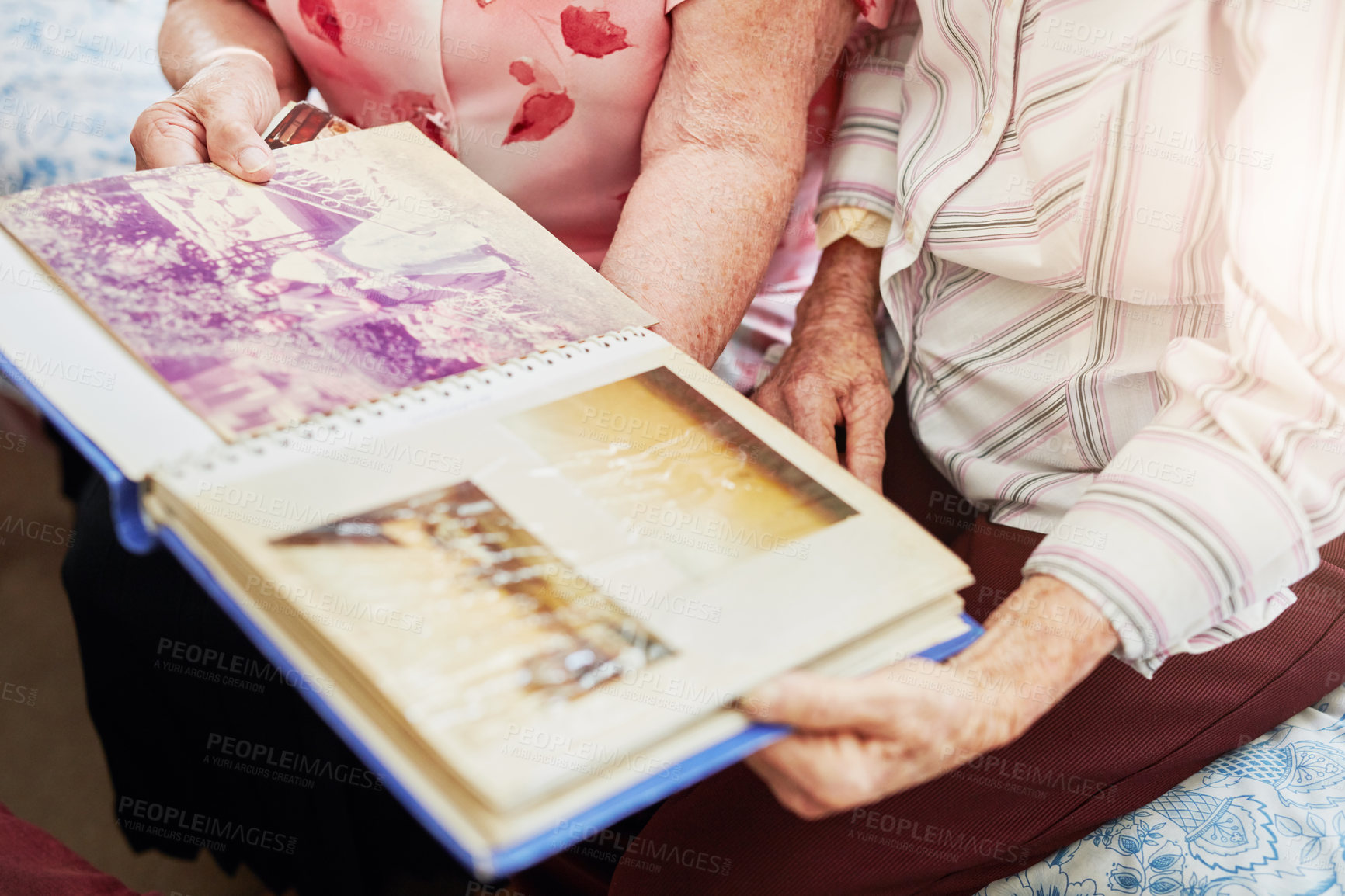 Buy stock photo Photo album, hands and senior friends in house for memory, remember or nostalgia for history. Picture book, women and elderly female people reminiscing together with conversation in retirement home.