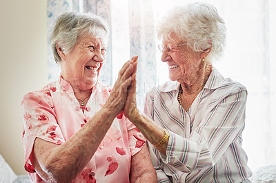 Buy stock photo Happy, friends and senior women with a high five for care, retirement support and happiness. Smile, team and elderly people with excited for solidarity or achievement success in nursing home together