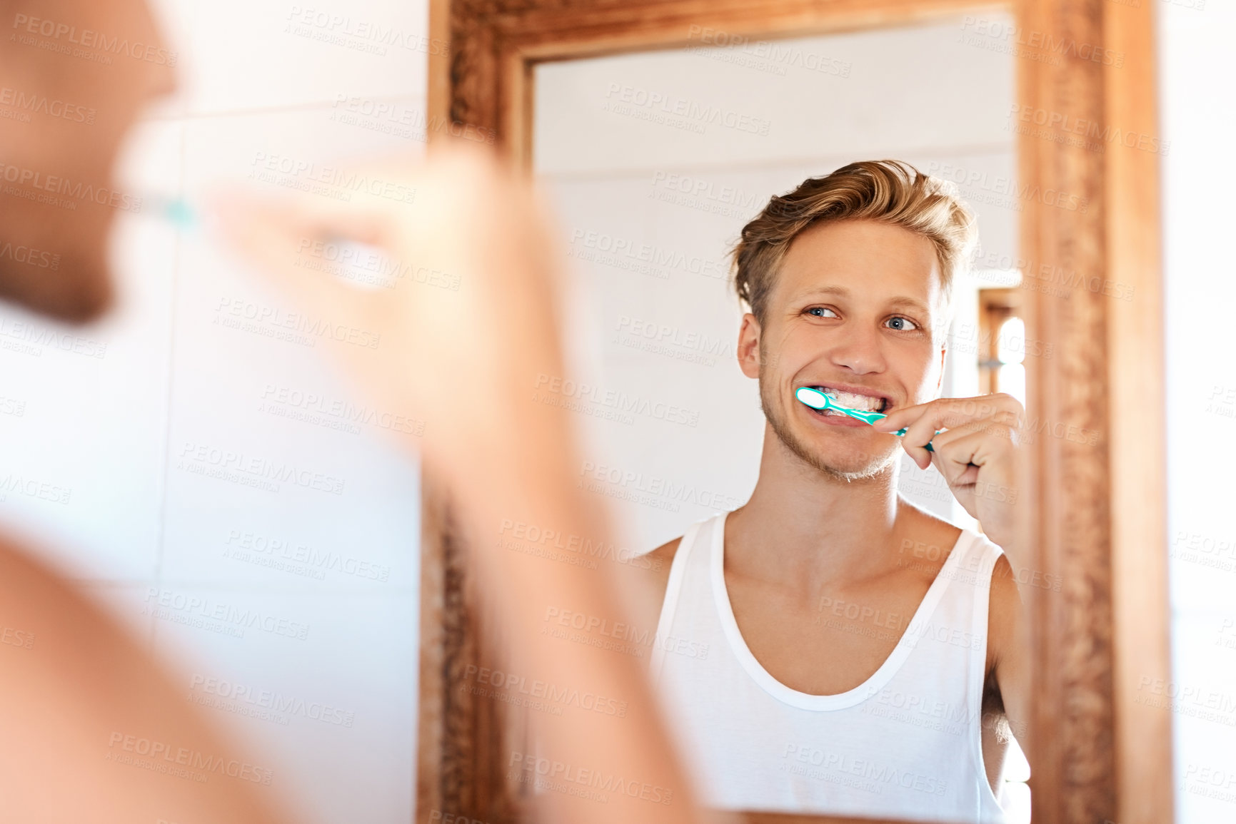 Buy stock photo Dental care, smile and man brushing teeth by mirror in home for health, wellness and morning routine. Reflection, oral hygiene and person with treatment for cavity, bacteria and plaque prevention.