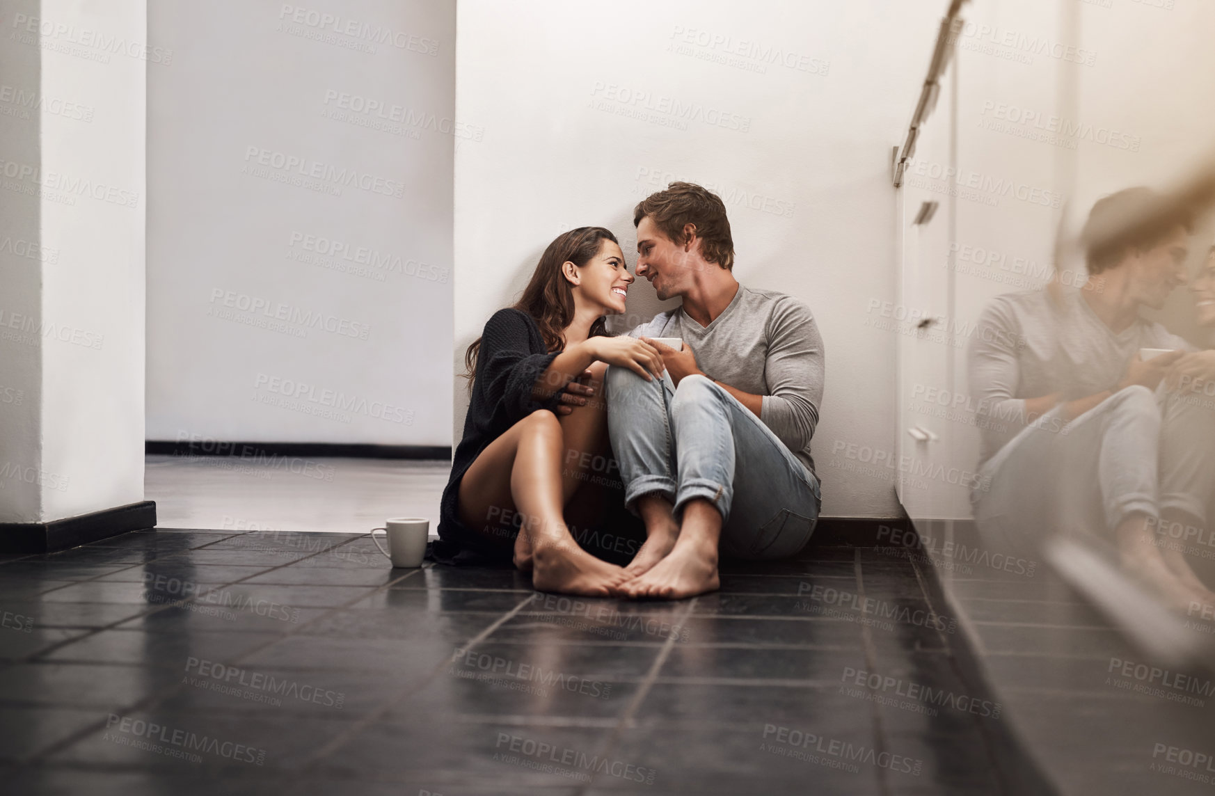 Buy stock photo Smile, coffee and couple on kitchen floor with care, morning bonding together and relationship love in home. Romance, happy man and woman relax in apartment with connection, drink or relax on weekend