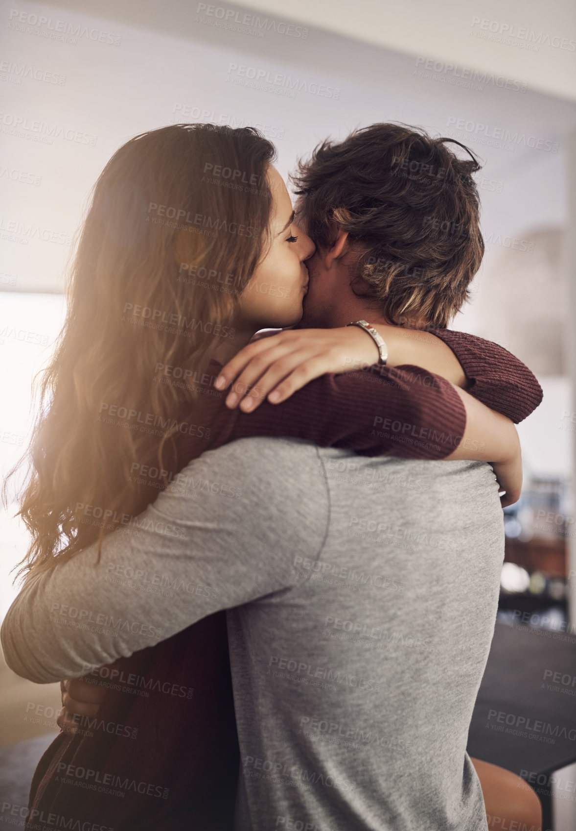 Buy stock photo Couple, hug and kiss in home for love, care and bonding for quality time together with trust, loyalty and happiness. Happy young man, woman and kissing for affection, romance or intimate relationship