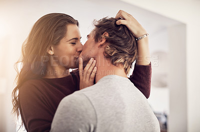 Buy stock photo Face of happy woman, man and kiss with love in apartment for romance, intimacy and special moment together. Young couple kissing in home for romantic relationship, happiness and passionate partner 