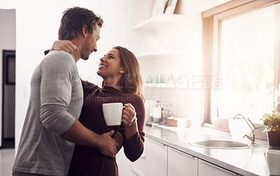 Buy stock photo Morning, coffee and couple in home with hug, smile or romantic bonding together in kitchen. Love, happy man and woman embrace with drink, laughing and relax with relationship support in apartment