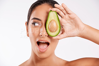 Buy stock photo Skincare, avocado and woman surprise in studio, natural beauty and collagen facial routine for glow. Skin health, wellness and person with fruit for dermatology wow for nutrition by white background.