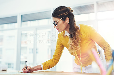 Buy stock photo Tailor, workshop and measurement for seamstress, startup or trendy small business. Designer, low angle and drawing for creative, boutique clothes and skills in artistic design studio for entrepreneur