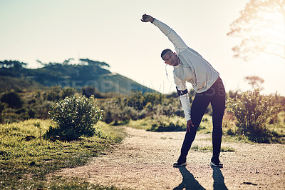 Buy stock photo Fitness, stretching arms and black man in mountain with headphones, health and wellness for outdoor run. Body workout, warm up and athlete in nature with music, earphones and exercise on natural path