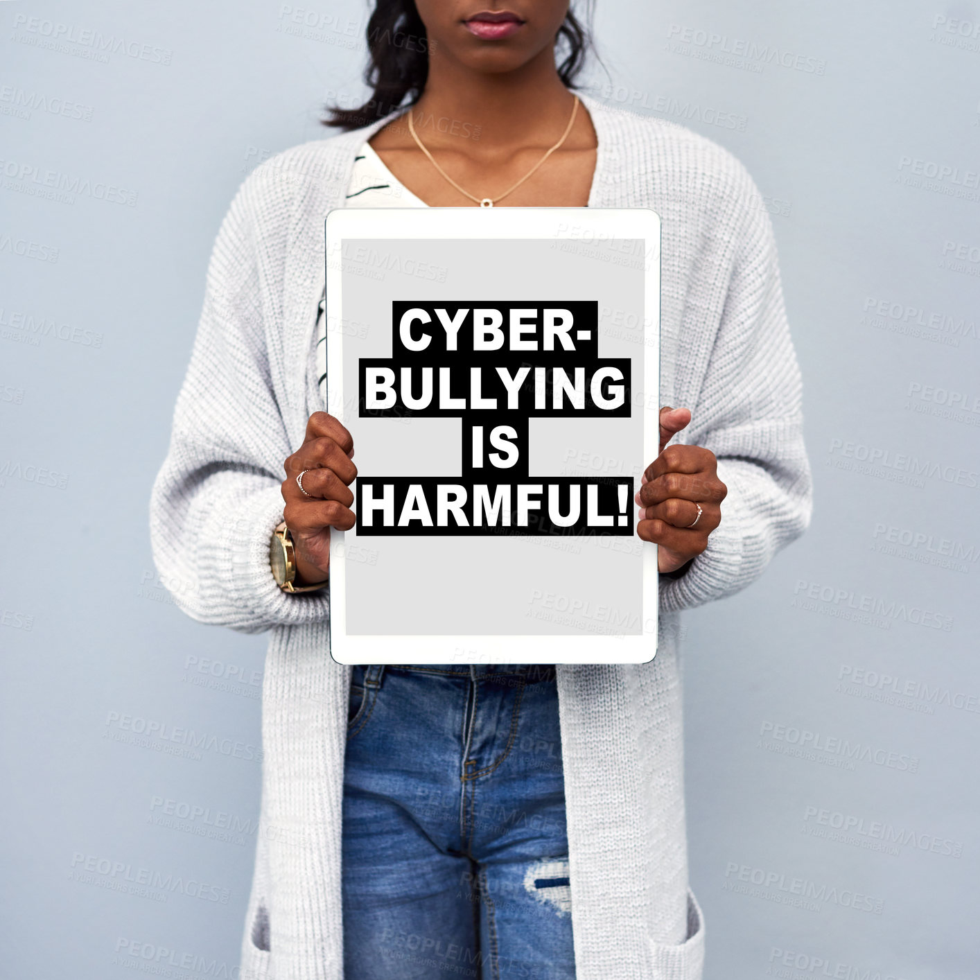 Buy stock photo Studio shot of an unrecognizable young woman holding a tablet with the message 