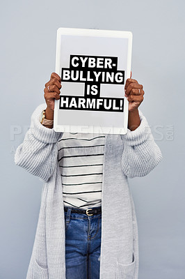 Buy stock photo Advertising, screen and woman with tablet in studio for social media, cyberbullying or activism. Digital poster, banner and person with tech for online safety, security and privacy on gray background